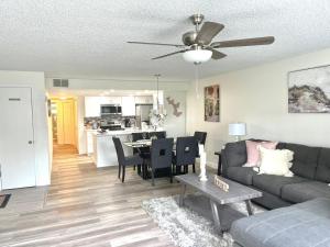 a living room with a couch and a table at Grand Family 3BD Condo Apartment near Disney Parks #5 in Kissimmee