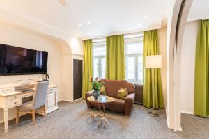 Sjónvarps- og/eða afþreyingartæki á Altstadthotel Wolf-Dietrich