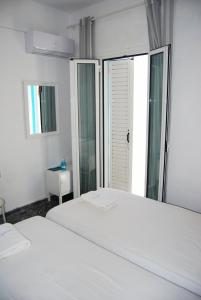 Postel nebo postele na pokoji v ubytování Grandma Vasiliki Rooms To Let