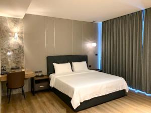 Postel nebo postele na pokoji v ubytování Dream Summer Hotel