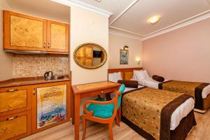 Kuchyň nebo kuchyňský kout v ubytování Santa Ottoman Hotel