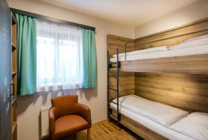Postel nebo postele na pokoji v ubytování JUFA Hotel Erlaufsee + 37 fotografií