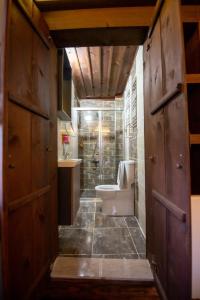 a bathroom with a tub and a toilet and a sink at KÜRKÇÜ KONAK in Safranbolu