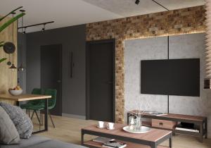 Telewizja i/lub zestaw kina domowego w obiekcie Loft Klonowa - Apartament z garażem