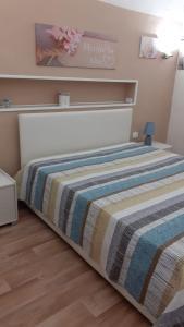Postel nebo postele na pokoji v ubytování Lo Sbarco