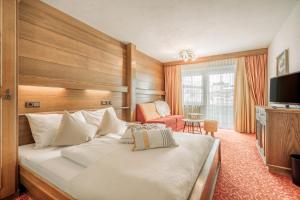 Ένα ή περισσότερα κρεβάτια σε δωμάτιο στο Fortuna Apart Hotel B&B