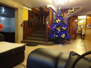 a living room with a christmas tree and a staircase at Cerro Rico in Potosí