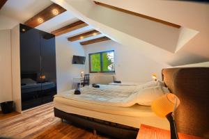 a bedroom with a large bed in a room at Willa Pod Skocznią in Szczyrk