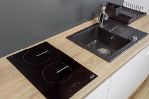 Kuchnia lub aneks kuchenny w obiekcie K2 Apartamenty