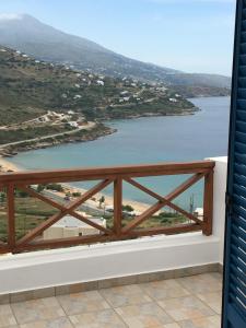 a view of the water from a balcony at Monolithos Villas in Kipri