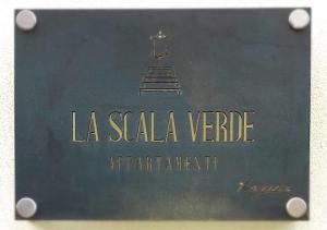 a sign with the words la santa veronicavenue agreement at La scala verde in Ragusa