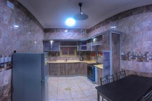 مطبخ أو مطبخ صغير في Al Tal Serviced Apartments
