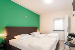 Postel nebo postele na pokoji v ubytování Onder de Pannen
