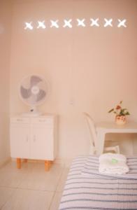 a bedroom with a bed with stars on the wall at Hotel Paradiso in João Pessoa