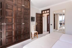Cama ou camas em um quarto em Parque Santiago V Official