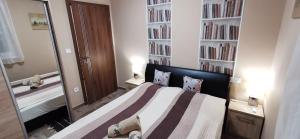 Postel nebo postele na pokoji v ubytování Balaton&Center Wellness Apartman + 30 fotografií