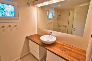 a bathroom with a sink and a mirror and a shower at Paleopetres K-Five - Premium Double Suite - Kalami - in Kalami +67 photos
