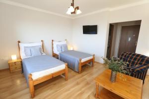 Posteľ alebo postele v izbe v ubytovaní Hotel Zámeček Janovičky