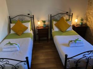 Postel nebo postele na pokoji v ubytování B&B Mandorla Amara