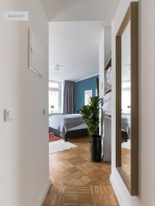 Ένα ή περισσότερα κρεβάτια σε δωμάτιο στο Apartments Berlin Aroser Allee