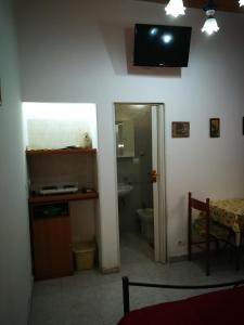 a room with a bathroom with a sink and a toilet at Casa del vico in Catania