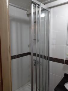 a bathroom with a shower stall and a glass door at Royal Suites Sultanahmet in Istanbul