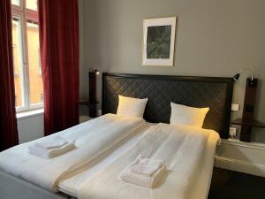 Postel nebo postele na pokoji v ubytování Unique Hotel Jungfrugatan