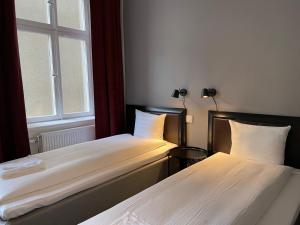 Postel nebo postele na pokoji v ubytování Unique Hotel Jungfrugatan
