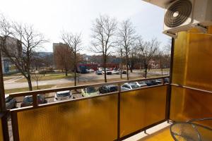 a balcony with a view of a parking lot at Aliz Apartman in Miskolc
