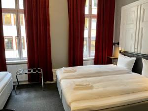 Postel nebo postele na pokoji v ubytování Unique Hotel Jungfrugatan
