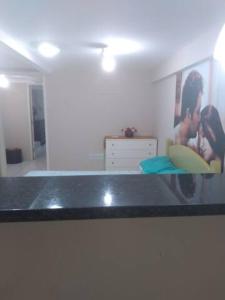 a counter top in a room with a picture on the wall at Pousada do Ribeirão in Andrelândia +83 photos