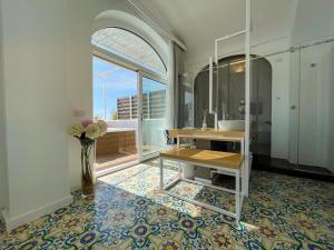 a bathroom with a sink and a vase of flowers at Hotel Montemare in Positano