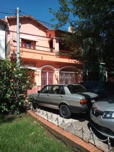two cars parked in front of a house at Brisas del Parque in Salta +11 photos