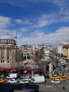 a city with cars parked in a parking lot at Martinenz Hotel Old City in Istanbul