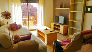 Telewizja i/lub zestaw kina domowego w obiekcie Apartamentos Sotavento - Playa La Tejita - El Médano