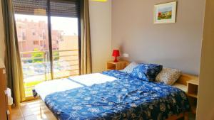 Łóżko lub łóżka w pokoju w obiekcie Apartamentos Sotavento - Playa La Tejita - El Médano
