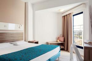 Postel nebo postele na pokoji v ubytování Lantiana Gardens ApartHotel + 37 fotografií