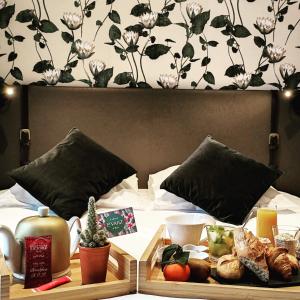 a tray of food sitting on top of a bed at La Valiz in Lille