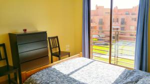 Łóżko lub łóżka w pokoju w obiekcie Apartamentos Sotavento - Playa La Tejita - El Médano