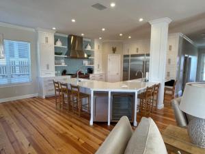 a kitchen with a large white island in a room at Seaspray in Santa Rosa Beach