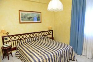 Postel nebo postele na pokoji v ubytování Hotel Blue Rose's