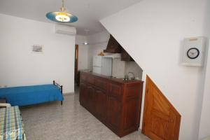 A bed or beds in a room at Afroditi Syros