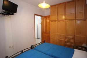 A bed or beds in a room at Afroditi Syros