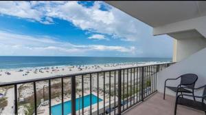 a balcony with a view of the beach and the ocean at Island Winds East in Gulf Shores