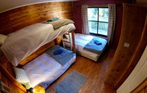 Postel nebo postele na pokoji v ubytování Hotel Andes Pucón