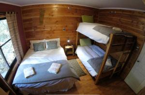 Postel nebo postele na pokoji v ubytování Hotel Andes Pucón