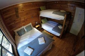 Postel nebo postele na pokoji v ubytování Hotel Andes Pucón