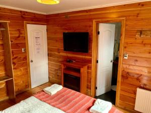Postel nebo postele na pokoji v ubytování Hotel Andes Pucón