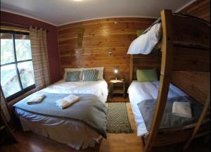 Postel nebo postele na pokoji v ubytování Hotel Andes Pucón
