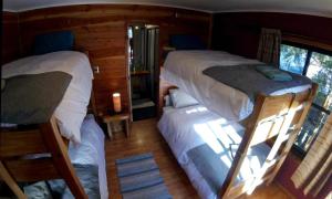 Postel nebo postele na pokoji v ubytování Hotel Andes Pucón